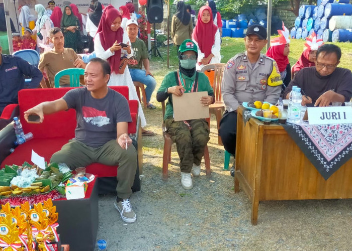 Bhabinkamtibmas Polsek Cikande Dampingi Warga Kegiatan Hiburan Masyarakat Memeriahkan HUT RI Ke 78